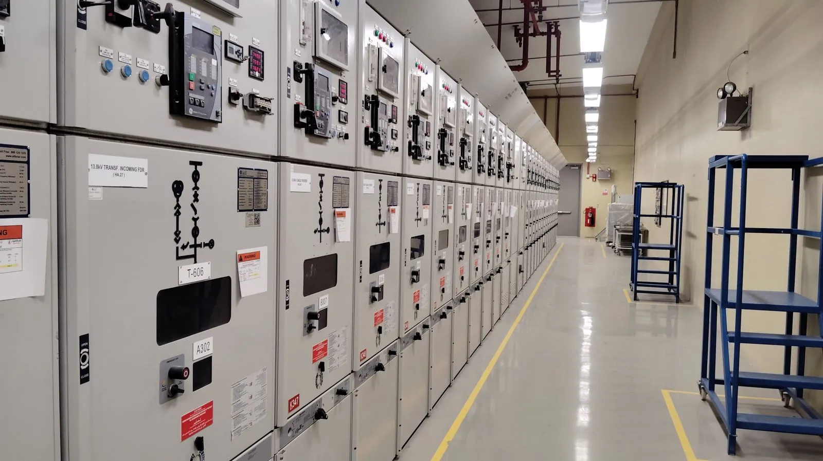 Circuit breakers, relays, and electrical components inside a modern control environment.